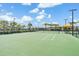 Community tennis court with professional netting surrounded by landscaped grounds at 31837 Cannon Rush Dr, San Antonio, FL 33576