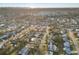 Aerial view of the neighborhood with tree coverage on a sunny day at 3218 Fauna St, Sarasota, FL 34235