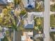 Aerial view of the backyard with stone walkway and patio seating at 3218 Fauna St, Sarasota, FL 34235