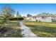 Well maintained lawn with a stone walkway leading through the backyard at 3218 Fauna St, Sarasota, FL 34235