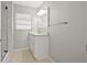Bright bathroom featuring a modern vanity with white cabinets and a white countertop at 3218 Fauna St, Sarasota, FL 34235