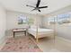 Bright bedroom with large windows and ceiling fan at 3218 Fauna St, Sarasota, FL 34235