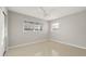 Minimalist bedroom with neutral color palette and natural light at 3218 Fauna St, Sarasota, FL 34235