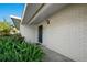 Inviting front entrance with a freshly painted door, well kept plants, and clean brickwork at 3218 Fauna St, Sarasota, FL 34235