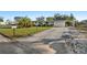Beautiful home featuring a large driveway and well-manicured lawn, showcasing curb appeal at 3218 Fauna St, Sarasota, FL 34235