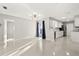 Open-concept living room offers lots of natural light and access to the kitchen at 3218 Fauna St, Sarasota, FL 34235