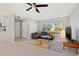 Bright and open living room featuring neutral walls, a gray sofa, and modern decor at 3218 Fauna St, Sarasota, FL 34235
