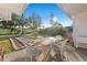 Covered patio with outdoor dining set, perfect for enjoying meals outside at 3218 Fauna St, Sarasota, FL 34235