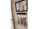 Bathroom wall featuring mirror, painting and towels at 3265 Beneva Rd # 202, Sarasota, FL 34232