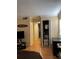 Open bedroom featuring hardwood floors, 'Surf Shack' decor, and an organized closet at 3265 Beneva Rd # 202, Sarasota, FL 34232