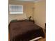 Cozy bedroom with a comfortable bed, accent lamps and neutral-toned walls at 3265 Beneva Rd # 202, Sarasota, FL 34232