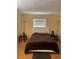 Bedroom featuring a cozy bed, hardwood floors, and a neutral color scheme at 3265 Beneva Rd # 202, Sarasota, FL 34232