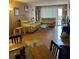 Inviting living room features wood floors, sliding doors and neutral walls at 3265 Beneva Rd # 202, Sarasota, FL 34232