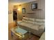 Comfortable living room with beige sofa, modern glass coffee table, and stylish decor at 3265 Beneva Rd # 202, Sarasota, FL 34232