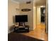 Cozy living room with hardwood floors, entertainment center and 'Surf Shack' decor at 3265 Beneva Rd # 202, Sarasota, FL 34232