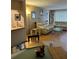Inviting living room with modern decor, comfortable seating, and a view into dining area at 3265 Beneva Rd # 202, Sarasota, FL 34232