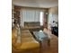 Cozy living room with two beige couches, a glass coffee table, and neutral decor at 3265 Beneva Rd # 202, Sarasota, FL 34232