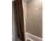 Neutral tiled shower with curtain rod at 3265 Beneva Rd # 202, Sarasota, FL 34232