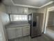 Modern kitchen features stainless steel appliances, granite countertops, and ample cabinet space at 3320 Jackson Dr, Holiday, FL 34691