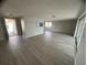 Spacious living room features durable laminate floors and plenty of natural light at 3320 Jackson Dr, Holiday, FL 34691