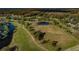 Aerial view of the golf course featuring ponds and lush greenery at 3830 Moreno Dr, Palm Harbor, FL 34685