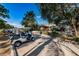 View of Lansbrook Golf Course clubhouse and golf cart parking on a sunny day at 3830 Moreno Dr, Palm Harbor, FL 34685