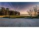 Community park with benches overlooking a serene lake and lush landscaping at 3830 Moreno Dr, Palm Harbor, FL 34685