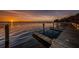 Community pier with sunset over the water at 3830 Moreno Dr, Palm Harbor, FL 34685