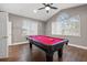 Game room with high ceilings, a ceiling fan, a pool table, and laminate flooring at 3830 Moreno Dr, Palm Harbor, FL 34685