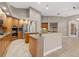 Gourmet kitchen with granite countertops, stainless steel appliances, and center island at 3830 Moreno Dr, Palm Harbor, FL 34685