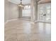 Spacious living room featuring neutral paint, tile flooring and a view of the front door at 3830 Moreno Dr, Palm Harbor, FL 34685