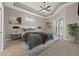 Spacious main bedroom featuring a tray ceiling, ceiling fan, and a sliding glass door to the pool at 3830 Moreno Dr, Palm Harbor, FL 34685
