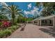 Community pavilion and seating area surrounded by lush landscaping at 3830 Moreno Dr, Palm Harbor, FL 34685