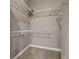 Walk-in closet with wire shelving for organization and neutral carpeting at 3830 Moreno Dr, Palm Harbor, FL 34685