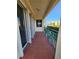 Wide balcony with tile floor and metal railing, overlooking the community at 4801 Osprey S Dr # 209, St Petersburg, FL 33711
