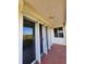 Balcony with tiled floor shows window and door access and scenic view at 4801 Osprey S Dr # 209, St Petersburg, FL 33711