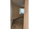 Bright bedroom featuring neutral walls, carpet flooring, and a window providing natural light at 4801 Osprey S Dr # 209, St Petersburg, FL 33711
