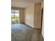 A bedroom with wall-to-wall carpet and a view to the outside at 4801 Osprey S Dr # 209, St Petersburg, FL 33711