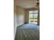 A bedroom with wall-to-wall carpet and a view to the outside at 4801 Osprey S Dr # 209, St Petersburg, FL 33711