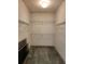 Empty walk-in closet with shelving at 4801 Osprey S Dr # 209, St Petersburg, FL 33711