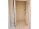An empty closet with a tile floor and white bi-fold doors at 4801 Osprey S Dr # 209, St Petersburg, FL 33711