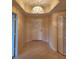 Foyer with tile flooring, closet, and elegant chandelier creating a welcoming ambiance at 4801 Osprey S Dr # 209, St Petersburg, FL 33711