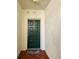 A green front door, adorned with a decorative wreath, welcomes you into the home at 4801 Osprey S Dr # 209, St Petersburg, FL 33711