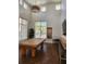 Bright game room with a pool table, large windows, high ceilings, and wood floors at 4801 Osprey S Dr # 209, St Petersburg, FL 33711