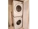A laundry room featuring stacked washer and dryer at 4801 Osprey S Dr # 209, St Petersburg, FL 33711