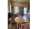 Bright library with built-in bookshelves, wood floors, tables, and comfortable seating at 4801 Osprey S Dr # 209, St Petersburg, FL 33711