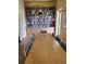 Spacious library with bookshelves full of books, long wood table, and seating at 4801 Osprey S Dr # 209, St Petersburg, FL 33711