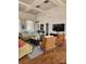 A large, bright living room with beautiful hard wood floors, modern lighting, and ample seating at 4801 Osprey S Dr # 209, St Petersburg, FL 33711