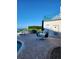 Outdoor pool area with lounge chairs and tables overlooking the water on a sunny day at 4801 Osprey S Dr # 209, St Petersburg, FL 33711