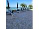Community outdoor pool area features lounge chairs and umbrellas overlooking the water at 4801 Osprey S Dr # 209, St Petersburg, FL 33711
